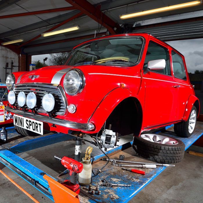 Mini Sport's Cooper demonstrator, new standard brake kit being fitted.